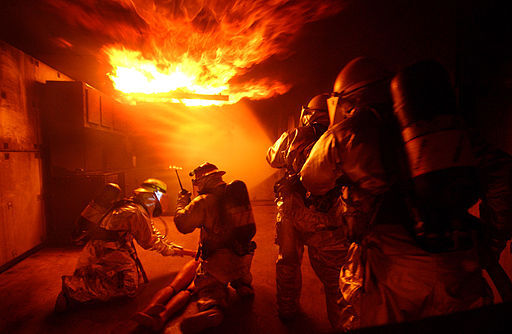 Airmen from the 18th Civil Engineer Squadron Fire Department conduct training at the Silver Flag area of Kadena Air Base, Japan, Dec. 2 during Beverly High 09-01, a local operational readiness exercise to test the readiness of Kadena's 18th Wing Airmen. (U.S. Air Force photo/Tech. Sgt. Rey Ramon)