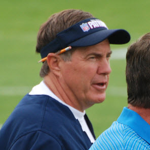 Bill Belichick in a blue, sleeveless hoodie. 