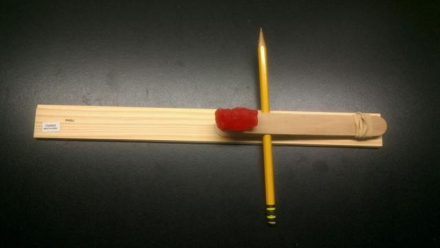 Gummi catapult in the low position, at the low angle, with the fulcrum far from the rubber band.